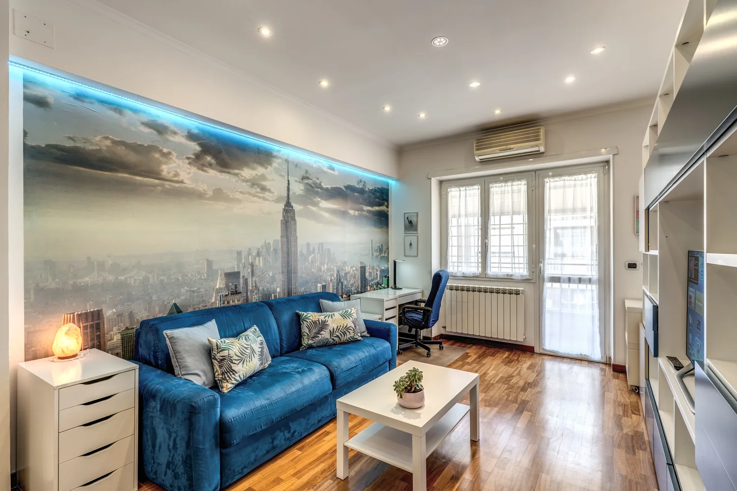 New York Apartment living room with blue sofa
